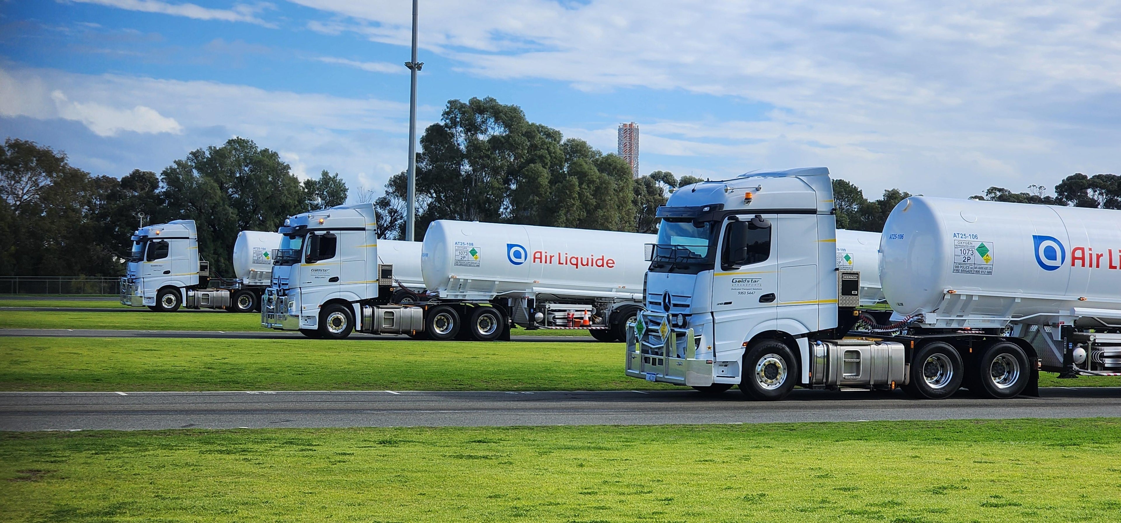 Goldstar air liquide truck fleet on grass