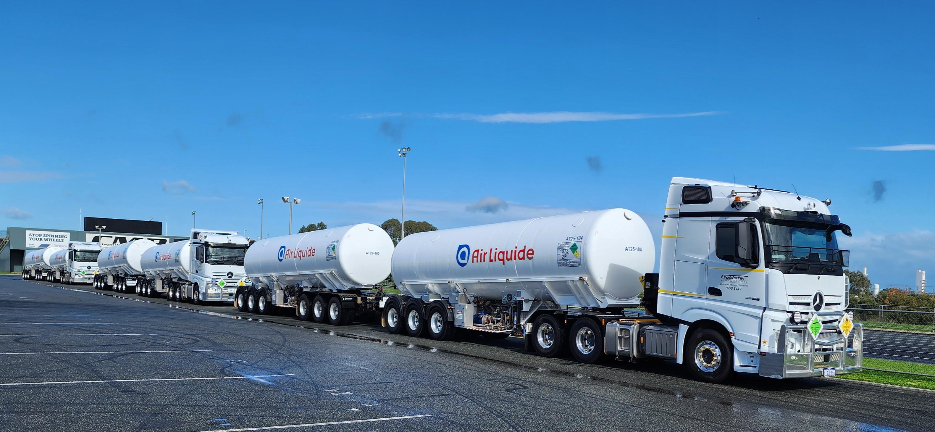 Goldstar air liquide road trains in a row on pavement